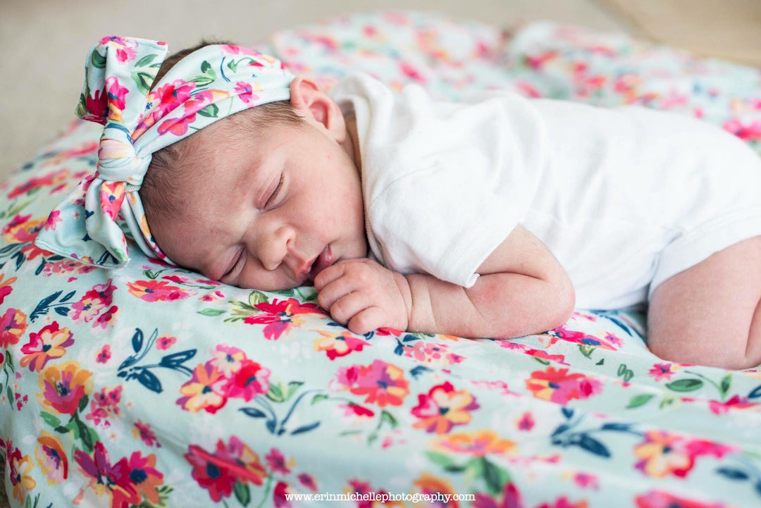 bumblito newborn stretch swaddle in Aqua Floral print