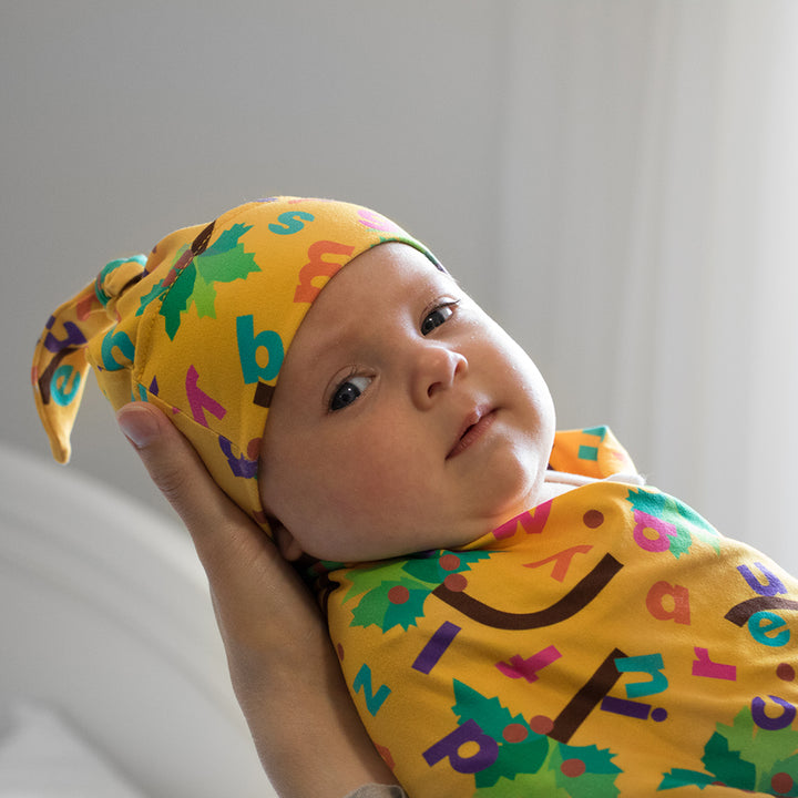 Bumblito - Stretch Swaddle - newborn swaddle - Chicka Chicka Boom Boom - yellow swaddle with alphabet letters